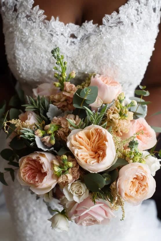 Close-up of a peach and cream bridal bouquet